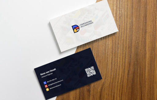 Dimensions Bouwadvies business cards on a wooden surface
